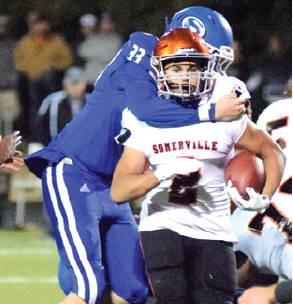SOMERVILLE’S JEREMIAH Teague is tackled by Snook’s David Davis at Friday night’s game. -- Tribune photo by Denise Hornaday
