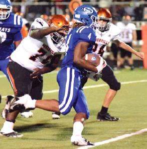 SNOOK RUNNINGBACK QWAN YOUNG breaks away from from the grasp of Somerville’s Cedric Hudgen for a Bluejay touchdown during Friday night’s game. -- Tribune photo by Denise Hornaday