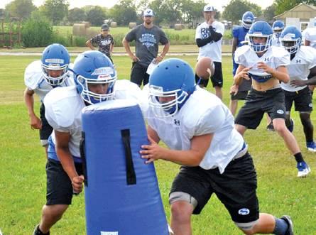 THE SNOOK BLUEJAYS work on their plays during a recent practice session. Snook is getting ready to open its season on Aug. 30 against Granger in Granger. -- Tribune photo by Roy Sanders