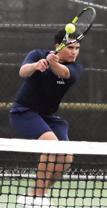 FELIPE GAUCIN eyes his shot during a district match earlier in the team tennis season at the Caldwell High School tennis courts. Tribune photo by Denise Squier