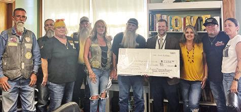 THE CRATER RALLY FAMILY presents Eric Holton with a $5,000 check for the Boys &amp; Girls Club of Somerville at the Tuesday, June 9, city council meeting. Tribune photo by Sabine Lazo