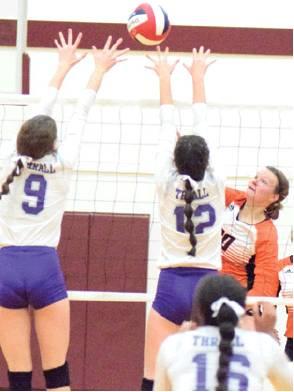 SOMERVILLE SENIOR GABBY Kovasovic hits the ball over the arms of two Thrall players during the Lady Yeguas’ bi-district loss on Monday in Milano. Kovasovic had nine kills in the loss.