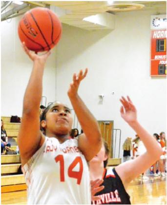 CALDWELL’S AALAYIAH Jones shoots the ball during the Caldwell-Smithville game on Friday. -- Tribune photo by Roy Sanders