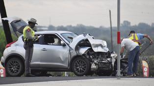 THE DPS INVESTIGATES at this two-car collision on Thursday morning, Sept. 3, on State Highway 212 West at the F.M. 60 intersection. One driver was injured/ Tribune photo by Roy Sanders