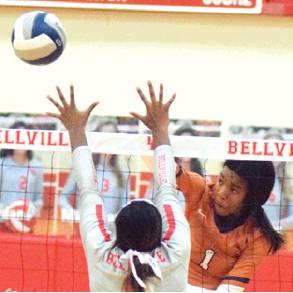 AALIYAH MASSINGILL hits the ball past Kearstin Carter during the Caldwell-Bellville District 26-4A match on Friday.