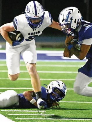 WYATT LOPEZ OF Snook carries the ball against Bartlett. Tribune photo by Denise Squier