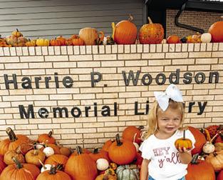 KAISLEY KUBENA holds this pumpkin in the pumpkin patch benefiting Project SNIP at the Harrie P. Woodson Memorial Library. For the Oct. 29 edition of The Tribune, email photos of your kiddos, or fur babies, with pumpkins for our special “Ghoul Zone” at news@bctribune.com by midnight on Monday, Oct. 26. Include your child’s name and any information about the photo.