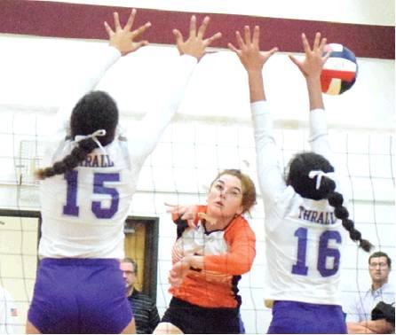 SOMERVILLE SENIOR MADDIE Cooper hits the ball into a block from Thralls’ frontline during the Lady Yeguas’ bi-district loss to Thrall on Monday. -- Tribune photo by Denise Hornaday