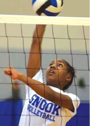 JAIVAN STRINGFELLOW, a Snook junior, hits the ball over the net during a volleyball practice last week. Stringfellow is one of the returning starters for Snook this season.