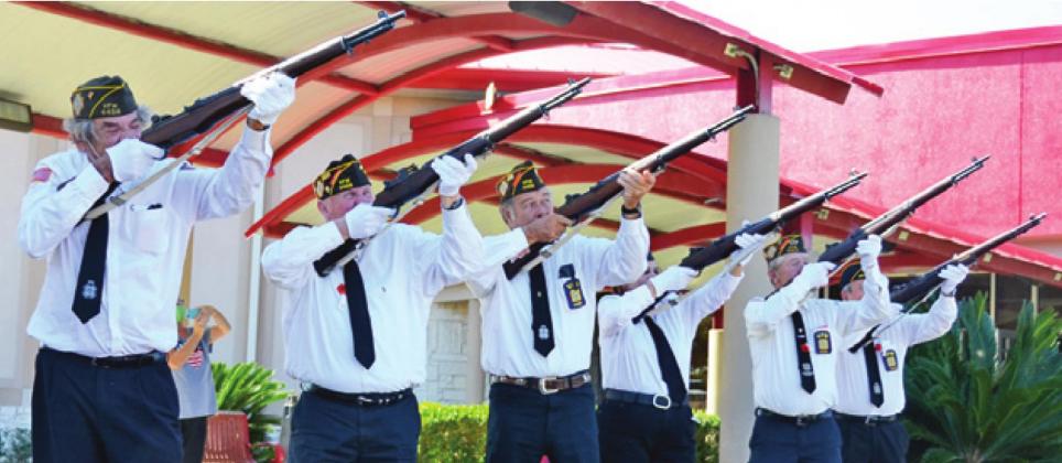 THE CALDWELL VFW RIFLE Honor Guard fires its three-volley salute at Veterans Day.