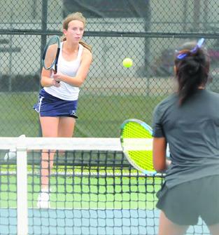 KYLIE VOGLER returns the ball during a mixed doubles match at the District 22-4A Tournament last week in Caldwell. She and Cayden Zboril won the mixed doubles title and qualified for the regional tournament.