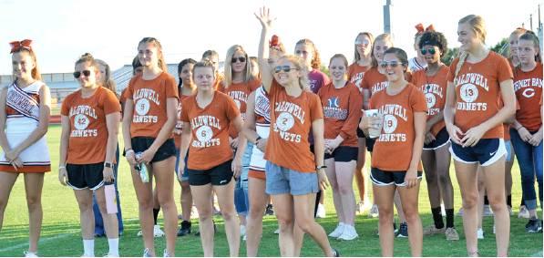 THE CALDWELL LADY HORNETS volleyball team greets the crowd on Monday night, Aug. 12, during the Meet the Hornets celebration at Hornet Field. Athletes and band members were recognized and greeted the crowd. -- Tribune photo by Roy Sanders