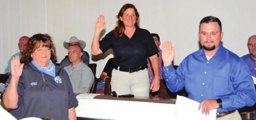 RESERVE OFFICERS ZETA Fail, Elizabeth Morris and Mark Koch are sworn into office on Sunday, March 15, by Burleson County Clerk Anna Schielack. -- Tribune photo by Roy Sanders
