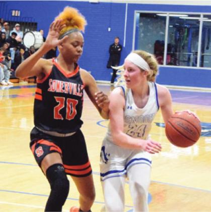SOMERVILLE’S XADRIA MARTIN defends against Snook’s Jaycie Brisco during a District 26-2A game. Brisco was recently named to the TABC and TGCA Class 2A All-State Girls Basketball Teams.