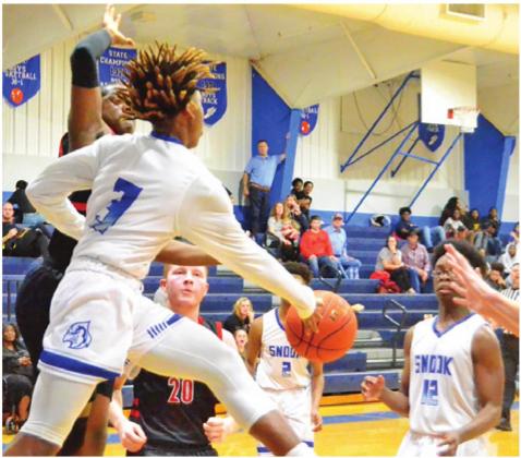 SIDNEY MACK OF Snook hurls this pass against Richards in Snook. The Bluejays won their last non-district game 68-60 and later lost to Iola in the district opener. -- Tribune photo by Roy Sanders