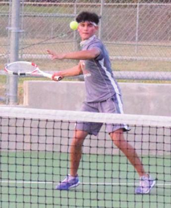 ADOLFO GAUCIN prepares to hit the ball during a match against Bastrop’s Chase Bracewell. -- Tribune photo by Denise Hornaday
