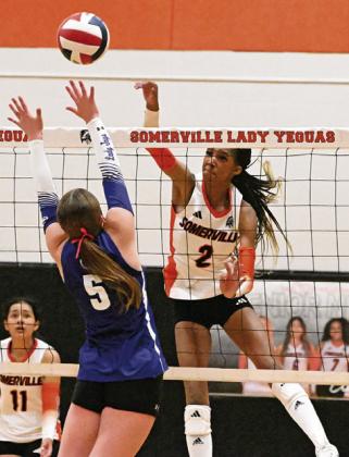 SOMERVILLE’S KARYS ELLIS earns one of her 11 kills against Snook last Tuesday by hitting the ball past Snook’s Kiley Price. Tribune photo by Denise Squier