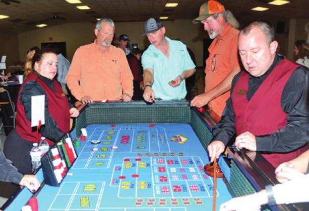 THE CALDWELL ROTARY CLUB’S Casino Night featured many Las Vegas-styled gaming tables such as this craps table. Many attended enjoyed the annual fundraiser. -- Tribune photo by Roy Sanders.