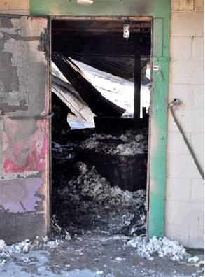 THE INTERIOR of Club 166 is gutted after an early Thursday morning fire off F.M. 166 in Tunis. -- Tribune photo by Roy Sanders