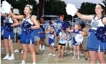 THE SNOOK MINI-CHEERLEADERS JOINED the Snook High School varsity cheerleaders in a dance and a couple of cheers to get the Snook faithful excited for the school year during Monday night’s Meet the Bluejays at Snook City Park. -- Tribune photo by Denise Hornaday