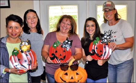 THE CITY OF CALDWELL is gearing up for the annual “Scare on the Square” in downtown on Saturday, Oct. 26. Pictured, from left, are Susan Mott, Burleson County Chamber of Commerce Executive Director, Debbie Sutherland, Nancy Bryan Stewart, Desiree Waters, and Melissa Brune. -- Tribune photo by Roy Sanders