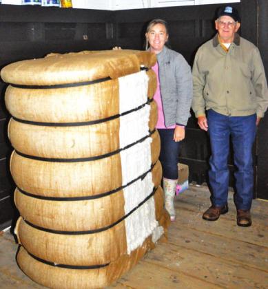 MARSHA KOCUREK AND Tommy Ryan are pictured with this cotton bale at the depot.