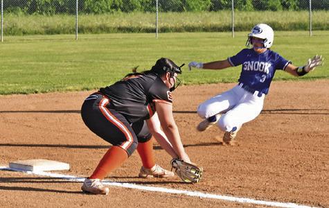 SNOOK’S MARISSA BATISTE slides into third while Somerville’s Aubrey Kovasovic sets to tag her out. -- Tribune photo by Roy Sanders