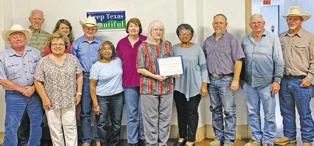 THE BURLESON COUNTY HISTORICAL Commission is recognized by the Texas Historical Commission with a Distinguished Service Award. Joining them are members of the Burleson County Commissioners Court. -- Tribune photo by Roy Sanders