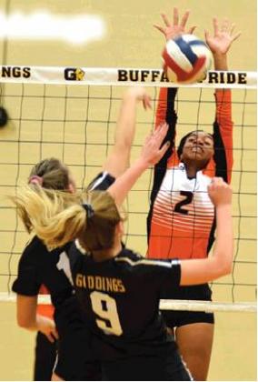 RAMAYA CARTER blocks a hit from Giddings’ Ryan Melcher on Tuesday. Also pictured is Giddings’ Brooklyn Walther.