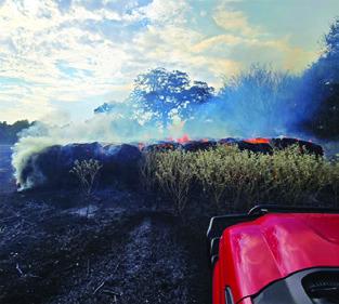 THESE HAY bales burn on Aug. 25 on Private Road 2011 off County Road 333. Photo courtesy of Caldwell VFD