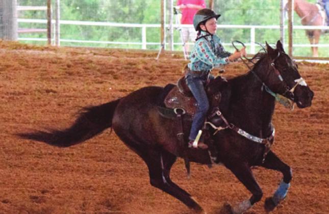 MANY FUTURE BARREL racers start off by competing in the Cloverleaf competition at the annual Burleson County Youth Rodeo.