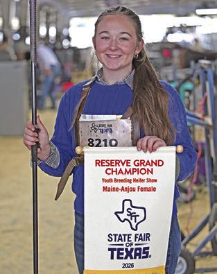 HADLEY HOWE poses with her Reserve Grand Champion banner for her Maine Anjou heifers at the 2026 State Fair of Texas. Photo courtesy of Burleson County 4-H