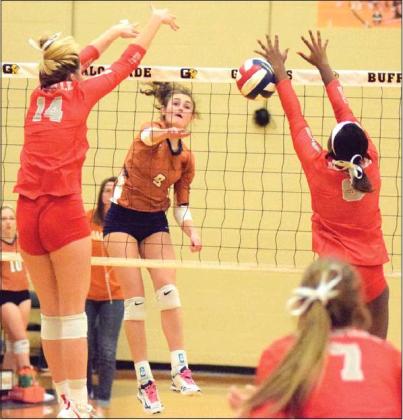 CALDWELL’S CORINNE DILLARD gets a kill during the Lady Hornets’ tie-breaker seeding match against Bellville on Friday night in Giddings. Bellville won the match and earned the top seed from District 26-4A for the UIL Class 4A Volleyball Playoffs which began this week.