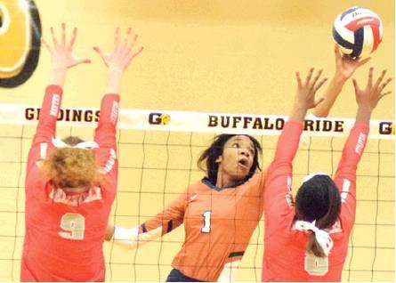 CALDWELL’S AALIYAH MASSINGILL stretches to push the ball over Bellville’s Kearstin Carter during Friday night’s tie-breaker seeding volleball match. Also pictured are Caldwell’s Emerson Faust and Bell-ville’s Sadie Mckay. -- Tribune photo by Denise Hornaday