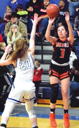 SOMERVILLE’S MADDIE Knox shoots over Snook’s Kamree Walker during their final district game last Tuesday night in Snook.