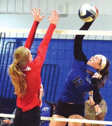 SNOOK’S RILEY GREEN HITS the ball over Burton’s Allie Hohlt during the Lady Jays’ win over the Lady Panthers in five sets.