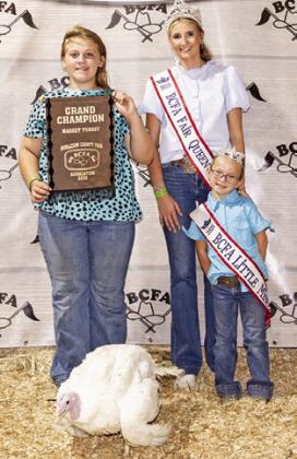 MARLEY KOCUREK exhibited the Grand Champion Market Turkey. She is pictured with Fair Queen Jolee Telschow and Little Miss Irene Kovar. Photo courtesy of Jessica Jeffries/ Jeffries Livestock Marketing