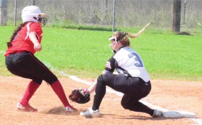 SNOOK’S LEIGHLA STRONG TAGS out a Burton runner at first base during the Lady Jays’ 13-5 victory over the Lady Panthers Wednesday afternoon in Snook. -- Tribune photo by Denise Hornaday