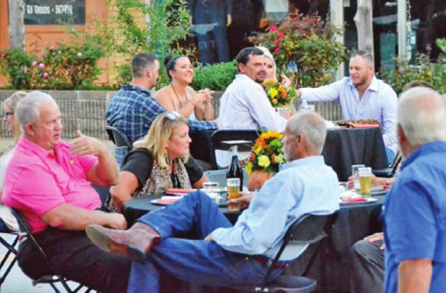 SUPPER ON THE Square is enjoyed by area residents on Saturday evening, Oct. 10, on Buck Street in downtown Caldwell. The chamber’s event was successful and enjoyed by people from Caldwell and the surrounding area. -- Tribune photo by Roy Sanders