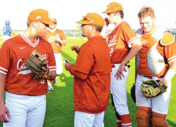 CALDWELL HEAD COACH Kyle Toney talks to Logan Knesek between innings of the Lampasas game. Also pictured are Barrett Spacek and Wade Tittle. -- Tribune photo by Roy Sanders