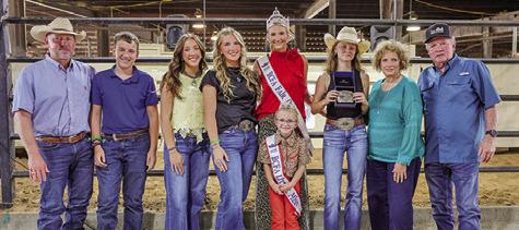 HALEY SEARS RECEIVES THE Christine Vogler memorial buckle, donated by Gary and Bridget Sebesta in memory of Vogler. Pictured, from left: Chad Vogler, Jackson Vogler, Kylie Vogler, Abby Vogler, Fair Queen Jolee Telschow, Little Miss Irene Kovar, Haley Sears, Bridget Sebesta and Gary Sebesta. Photo courtesy of Brandon Telschow