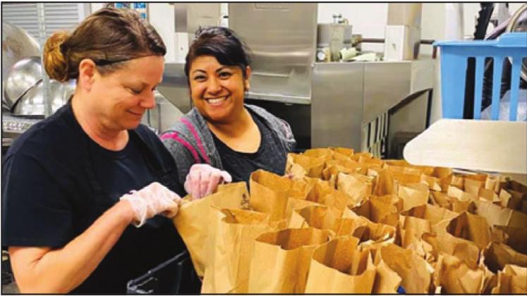 CALDWELL ISD PREPARES lunches for students to be delivered into the community. Area volunteers have been helping others in and around Burleson County throughout the coronavirus threat.