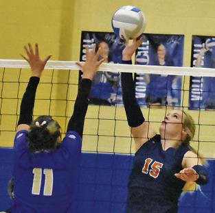 ADDISON HOLCOMB reaches to push the ball past a Rockdale blocker during Caldwell’s road win over the Lady Tigers on Friday. Tribune photo by Roy Sanders