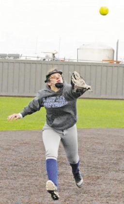 PAYTON SODOLAK sets her sights on a fly ball during the Snook-Burton game last week in Thrall.