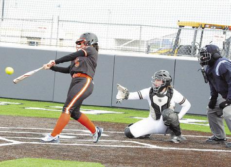 SOMERVILLE’S AVERIE HERNANDEZ hits a double, hitting the fence, during the Lady Yeguas’ win over Giddings last Thursday in the Thrall Invitational Softball Tournament. -- Tribune photo by Denise Squier