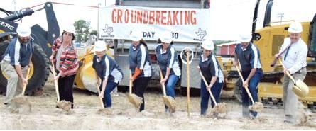 CISD BOARD MEMBERS AND ADMINISTRATION turn dirt at the groundbreaking ceremony at Caldwell High School for its new gymnasium and Career, Science and Technology (CTE) addition. Pictured, from left, are Tripp Warren, board president, Vicki Ochs, high school principal, Terri Jurena, board secretary, Clover Cochran, board member, Pam Evans, board vice president, Rebecca Gardner, board member, Mark Goodman, board member, and Andrew Peters, CISD superintendent. Not pictured is board member William Foster.