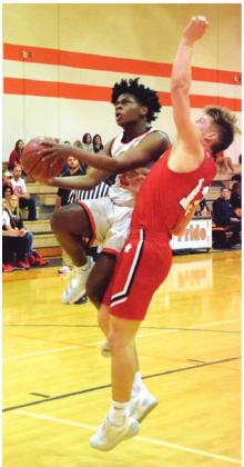 ARVIS BURNS is fouled while attempting a layup during Somerville’s home win over Burton. -- Tribune photo by Denise Hornaday