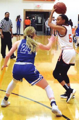 SOMERVILLE’S DESTINY VELA looks to pass the ball while Snook’s Kyleigh Hruska defends. -- Tribune photo by Denise Squier