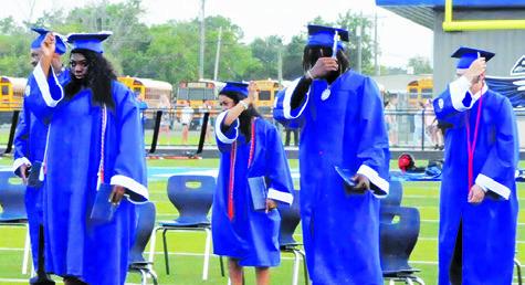 SNOOK HIGH SCHOOL GRADUATES move their tassels during Friday night’s graduation ceremony. -- Tribune photo by Denise Squier