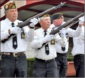 VFW RIFLE HONOR Guard members Tommy Miles, Donnie Frieda and Eddie Gaas fire their volleys at the Veterans Day ceremony.